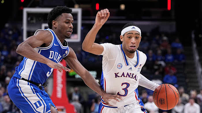 Kansas's Dajuan Harris Jr. drives vs. Duke